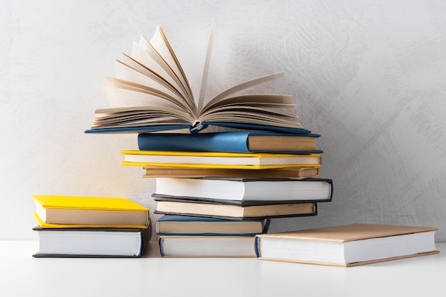 Pile of paperback books on a table