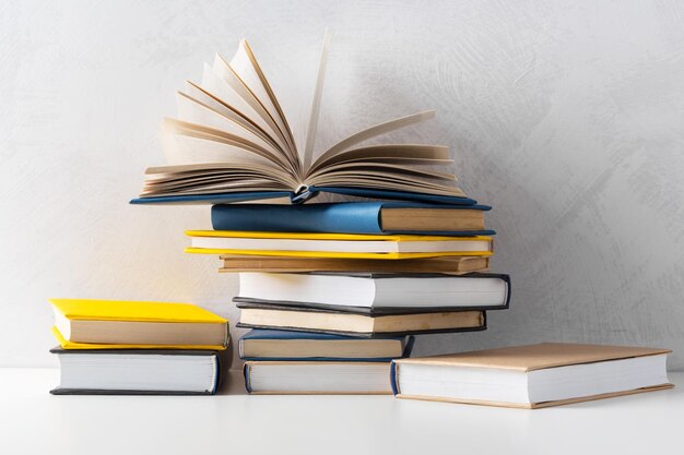 Pile of paperback books on a table