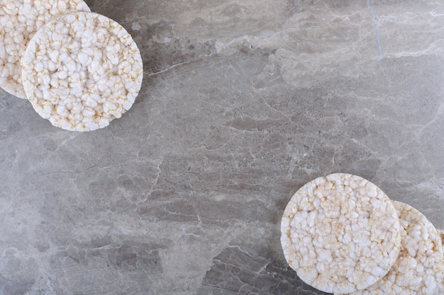 A pile of puffed rice cakes, on the marble surface