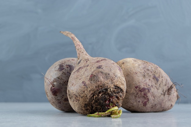 A pile of ripe radishes , on the marble.