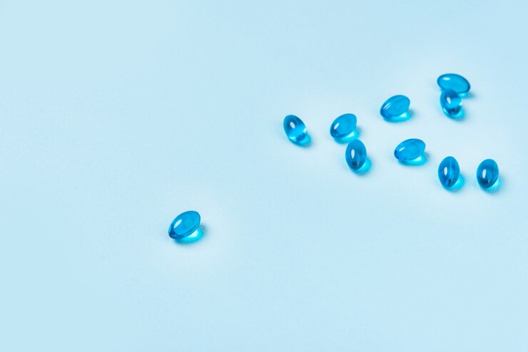 Free Photo pile of softgel blue capsule pills