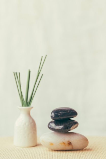 Pile of stones and white vase