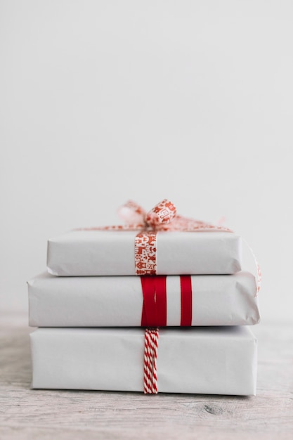 Free photo pile of white gift boxes on table