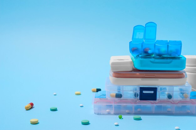 Pill boxes arrangement  on blue background