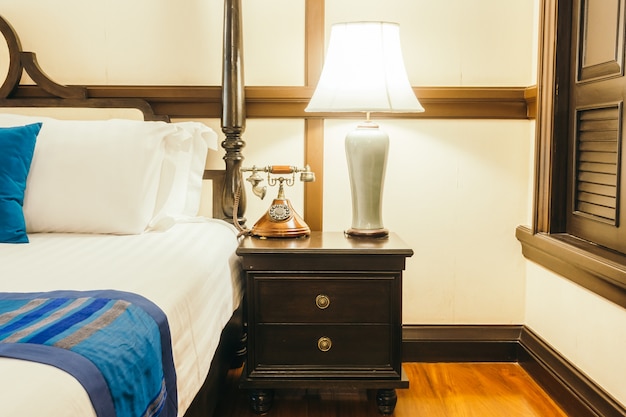 Pillow on bed with light lamp