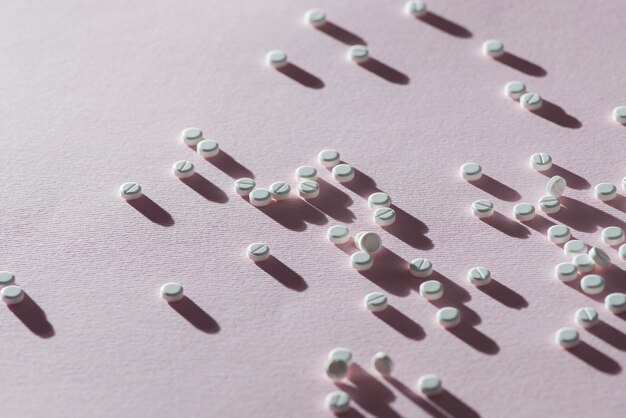 Pills assortment on pink background