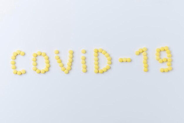 Pills for COVID-19 on a white background