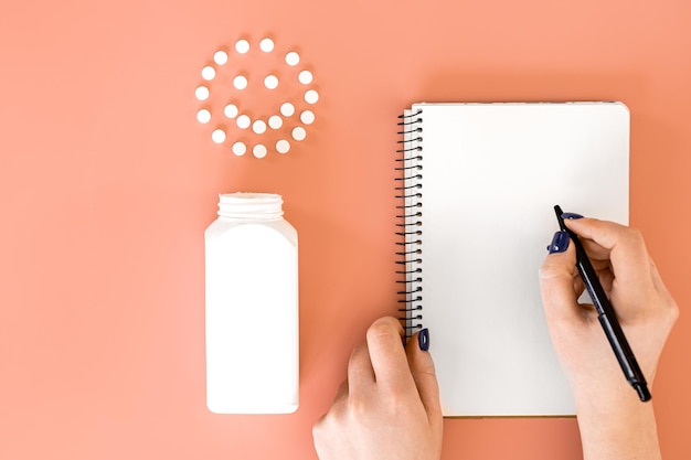 Pills on pink background flat lay medicine concept