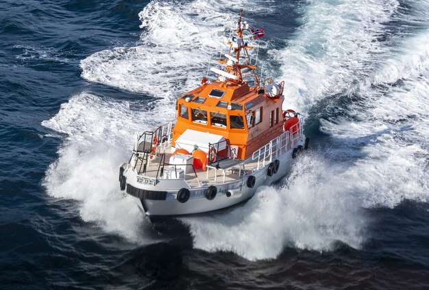 Pilot boat in motion on a sunny day in Norway