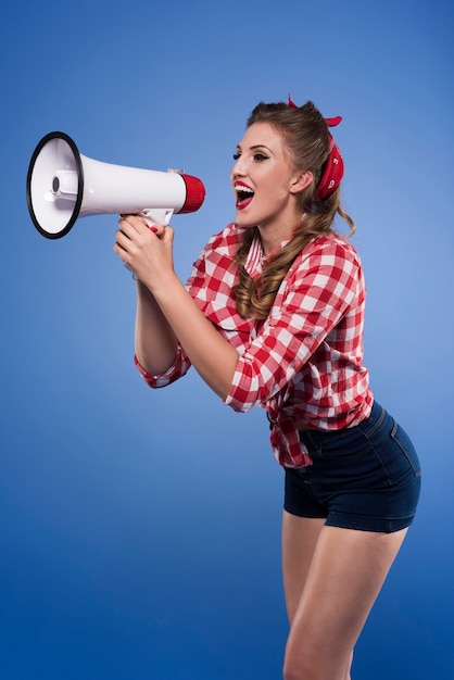 Pin up woman with megaphone isolated