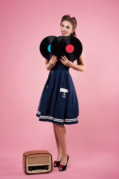 Free photo pin up woman with vintage vinyls isolated