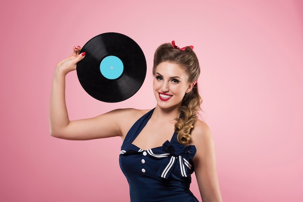 Pin up woman with vintage vinyls isolated