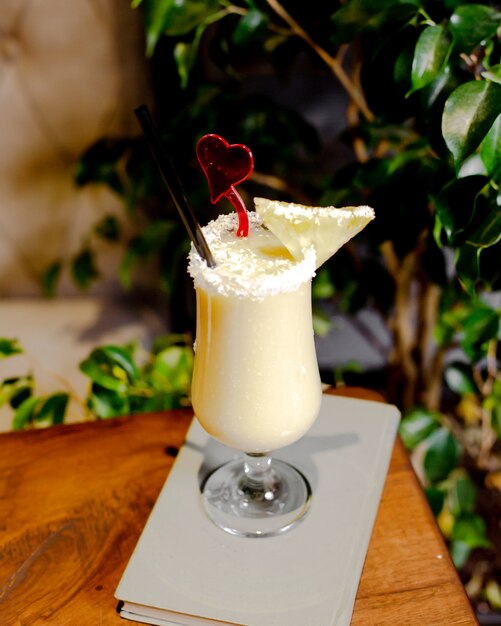 Pina colada cocktail with pineapple slice