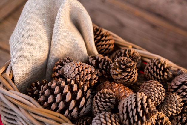 Free photo pine cones in a wicker basket