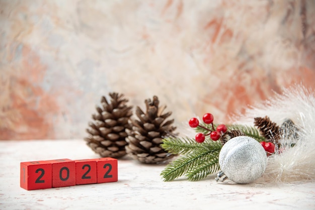 Pine nuts with red numbers and decorations as a new year concept on blurred background Premium Photo