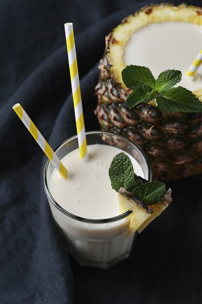 Pineapple cocktail with straw. Tropical drink