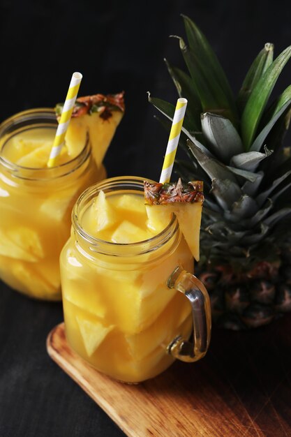 Pineapple cocktail with straw. Tropical drink