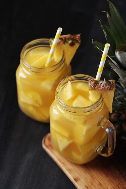 Pineapple cocktail with straw. Tropical drink