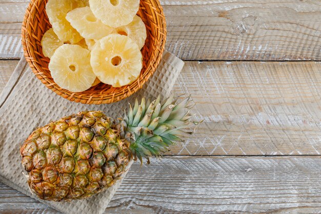 Pineapple with candied rings on kitchen towel