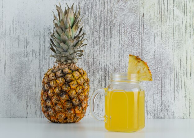 Pineapple with juice in a jar