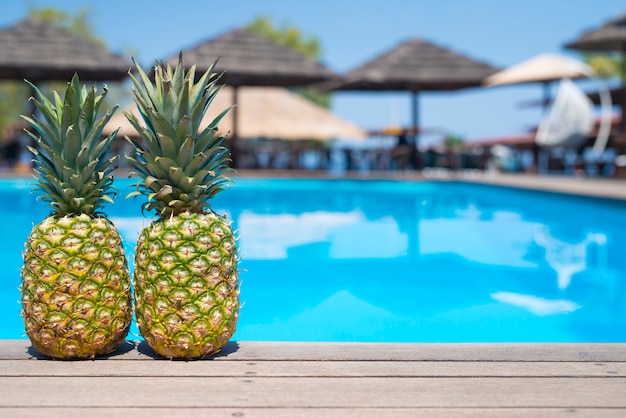 Pineapples by the pool in summertime