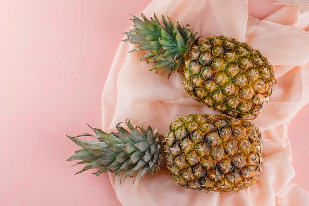 Pineapples on pink and textile surface