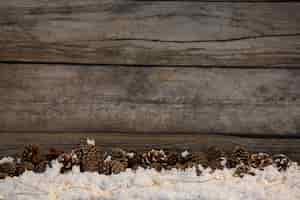 Free photo pinecone on fake snow