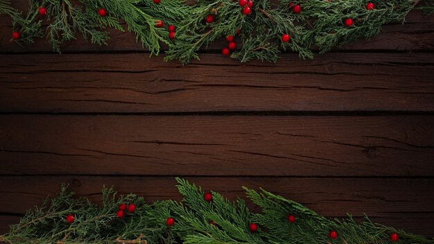 Pines christmas composition on a wooden frame background with copy space