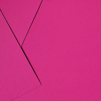 Pink abstract background inspired by material design using cardboard and paper