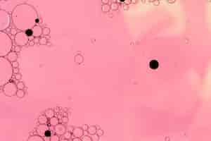 Free photo pink abstract bubbles with black dots