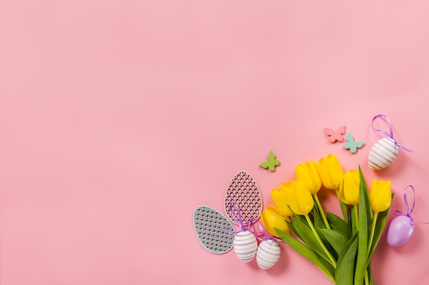 Pink background with flowers and easter eggs