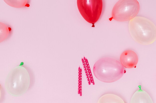 Pink balloons arrangement on pink background