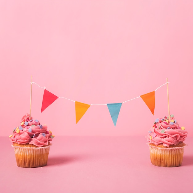 Pink birthday cupcake with garland