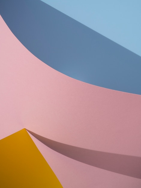 Pink and blue abstract paper shapes with shadow