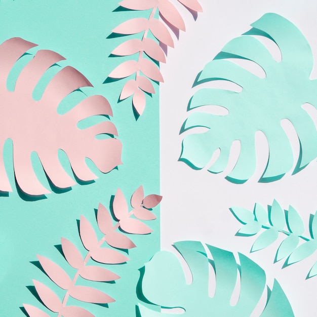 Free photo pink and blue paper foliage top view