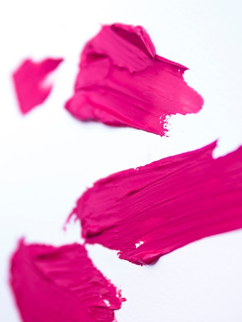 Pink brush strokes on white background