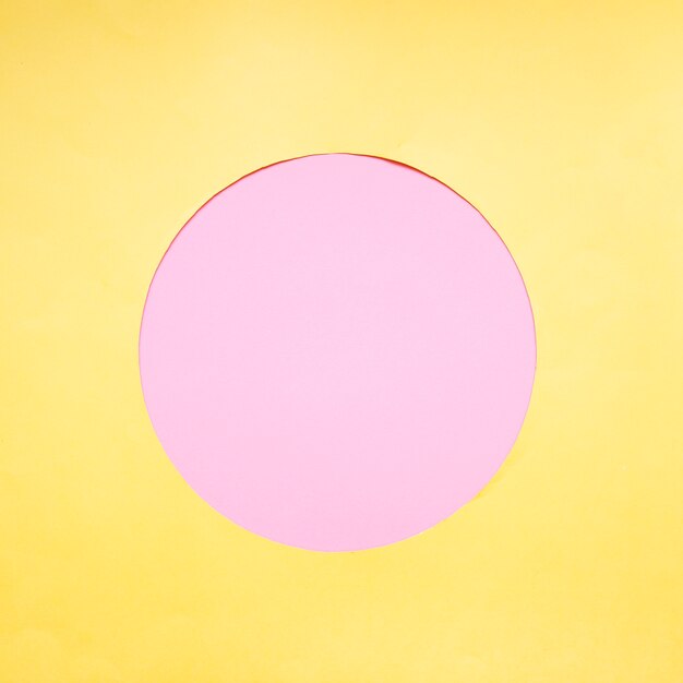 Pink circle on yellow background