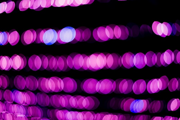 Free photo pink circular neon lights background