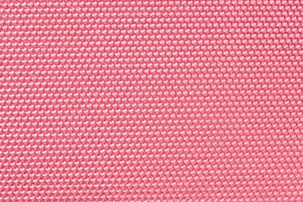 ピンク色のハニカムパターンの壁紙