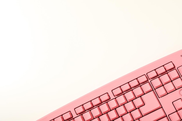Free photo pink computer keyboard on a white background