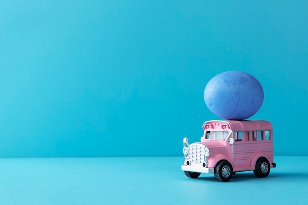 Pink easter car with egg still life