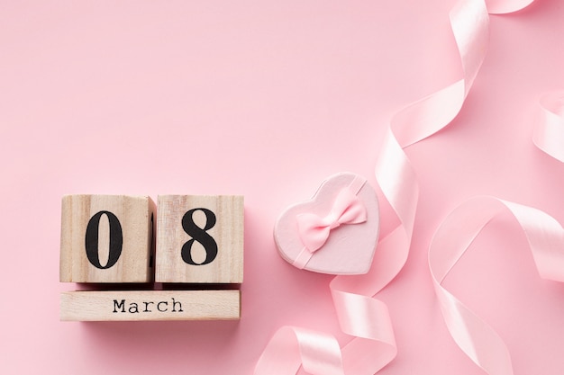 Free photo pink feminine elements with 8 march lettering and copy space