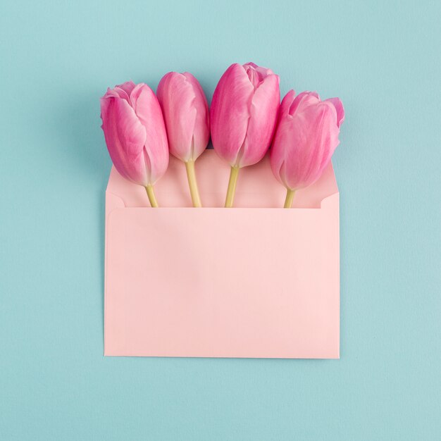 Pink flowers in paper envelope