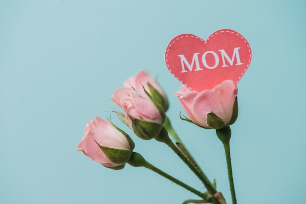 Pink flowers with paper heart for mother's day