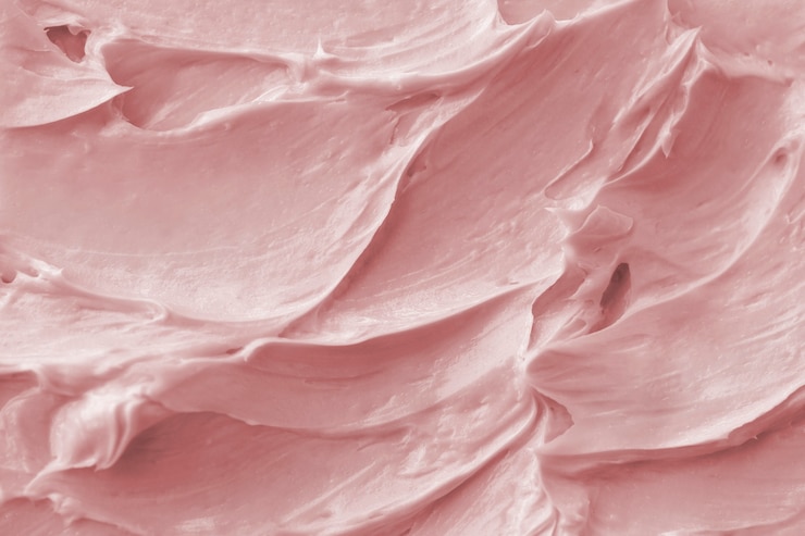 Free Photo pink frosting texture background close-up