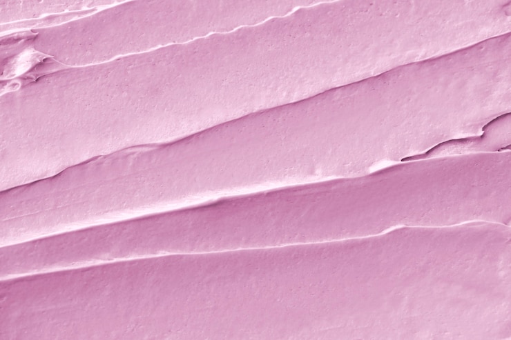 Free Photo pink frosting texture background close-up