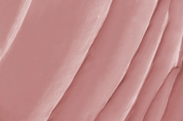 Free photo pink frosting texture background close-up