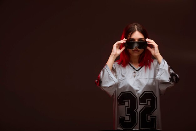 Pink hair girl in avantgarde style wearing sunglasses. 