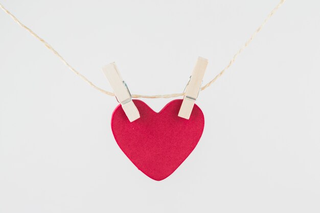 Pink heart hanging on rope 