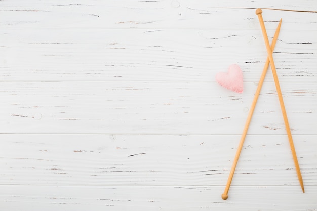 Pink heart shape cushion and crochet plank